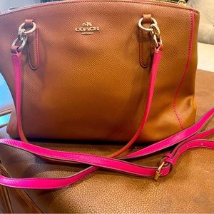 Brown leather coach purse lined in fuchsia pink